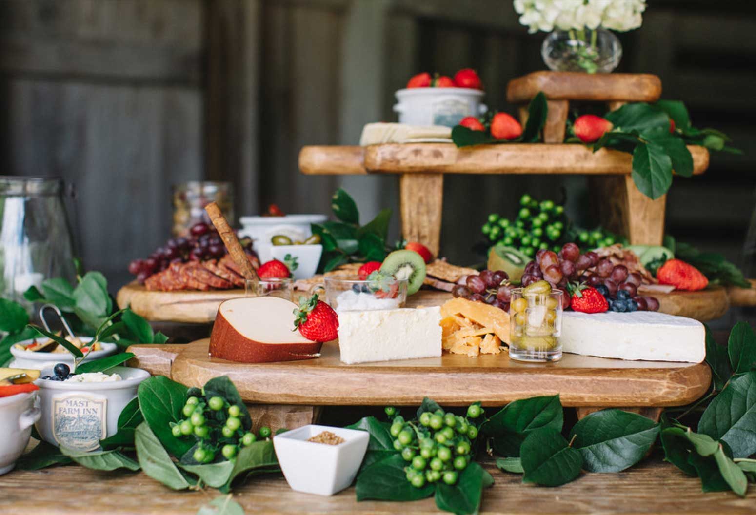 Beautifully arranged fruit, cheese and charcuterie trays